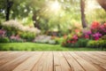 Empty wooden vintage table board on spring flower garden bokeh background. Royalty Free Stock Photo