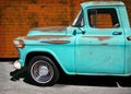 Vintage Aqua Truck parked in front of a Brick Wall Royalty Free Stock Photo