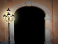 Vintage arched doorway with glooming lantern Royalty Free Stock Photo