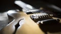 Vintage archtop guitar in natural maple close-up back light high angle view Royalty Free Stock Photo