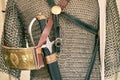 Vintage armor, retro chain mail and a sword in a scabbard. Ancient military arsenal of the events of the Russian-Swedish war Royalty Free Stock Photo