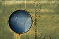 Vintage army background, circular window of an old military helicopter