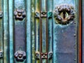 vintage, artistic tarnished green copper color plated door lock detail with ornate keyhole. Royalty Free Stock Photo