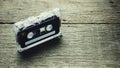 Vintage audio cassette tapes on wooden background. Royalty Free Stock Photo