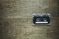 Vintage audio cassette tapes on wooden background. Royalty Free Stock Photo