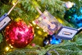 Vintage audio cassettes on the Christmas tree as decoration on New Years Eve - Moscow, Russia, December, 24, 2019