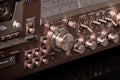 Vintage Audio Stereo Gear Setup Copper Front Panel with Multiple Controls Including Display, Knobs, Buttons, Keys, Switches