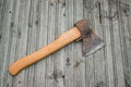 Vintage ax on wooden background. Soft focus. Copy space