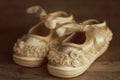 Vintage baby shoes on wood background Royalty Free Stock Photo