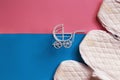 Vintage baby stroller on pink and blue background. Boy or girl question Royalty Free Stock Photo