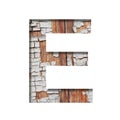 Vintage backdrop font.The letter E cut out of paper against the background of an old wooden wall with cracked paint. Decorative Royalty Free Stock Photo