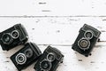 Vintage background. collection old vintage retro photo cameras on white wooden background. top view, medium format Royalty Free Stock Photo