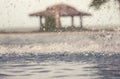 Vintage background with freezed water drops during rain on water surface with blurred background and selective focus Royalty Free Stock Photo
