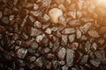 Vintage background of gravel. film grain. Texture of a wet road. One of a million. A special and outstanding object Royalty Free Stock Photo