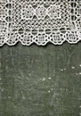 Vintage background with lace tablecloth on old wood Royalty Free Stock Photo