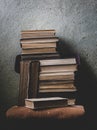 Vintage Background with Old Books. Stack of Books Folded on a Chair. Fragments of the Interior of the Old Library Royalty Free Stock Photo