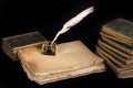 Vintage background with old ink bottle, books, papers and quill Royalty Free Stock Photo