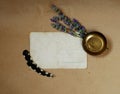 Vintage background with old postcard, snuffbox, bouquet of lavender and feathers Royalty Free Stock Photo