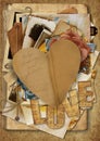 Vintage background with paper heart and old postcards and photos