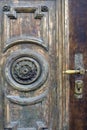 Vintage background shabby part of an old door with decorations. Part of a wooden door with scratches and an old peeling paint. Royalty Free Stock Photo