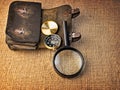 Vintage background with wallet, compass and magnifier Royalty Free Stock Photo