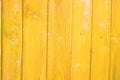 Background of yellow painted and scattered old wooden Royalty Free Stock Photo