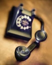 Vintage bakelite dial telephone on rustic metal surface. Selective focus Royalty Free Stock Photo