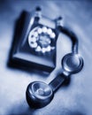 Vintage bakelite dial telephone on rustic metal surface. Selective focus Royalty Free Stock Photo