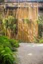 Vintage bamboo and wooden entrance gate. Traditional gate and fence of ancient village. Wooden and bamboo gate in Thailand rural c Royalty Free Stock Photo