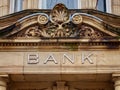 Vintage Bank Sign with Carved Stone Portal