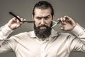 Barber scissors and straight razor, barber shop, suit. Vintage barber shop, shaving. Portrait bearded man. Mustache men Royalty Free Stock Photo