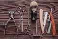 Vintage barber shop tools on wooden background Royalty Free Stock Photo