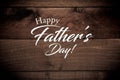 Vintage baseball gear on a wooden background with Father`s day greeting