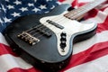 Vintage bass guitar on american flag background