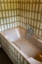 Vintage bath tub with retro tiles, old-fashioned