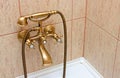 Vintage bathtub faucet and ceramic tiles Royalty Free Stock Photo