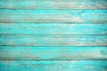 Old weathered wooden plank painted in turquoise or blue sea color. Royalty Free Stock Photo