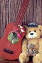Vintage bear toy with ukulele