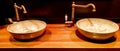 Vintage Beautiful faucet and golden mixer tap on a marble round sink in the bathroom. Interior of an expensive toilet with a Royalty Free Stock Photo