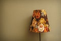 Vintage Bedroom floor lamp glowing orange in a corner of a room