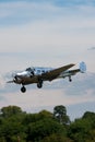 Vintage Beech G18S N45CF twin engine aircraft with highly polished natural metal finish.