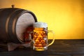 Vintage beer barrel with huge beer glass