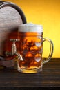 Vintage beer barrel with huge beer glass Royalty Free Stock Photo