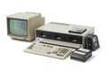 Vintage beige computer system with crt monitor keyboard and floppy disks from the 1980s Royalty Free Stock Photo