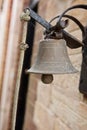 Vintage bell on stone wall