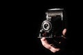 Vintage bellows camera in the hand of the photographer Royalty Free Stock Photo