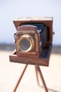 Brihuega, Spain 01/12/2020 Vintage bellows camera with wooden tripod Royalty Free Stock Photo