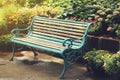 Vintage Bench in flower garden with vintage light filter