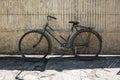Vintage bicycle against gate