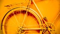 vintage bicycle back wheel paint into yellow as decoration Royalty Free Stock Photo